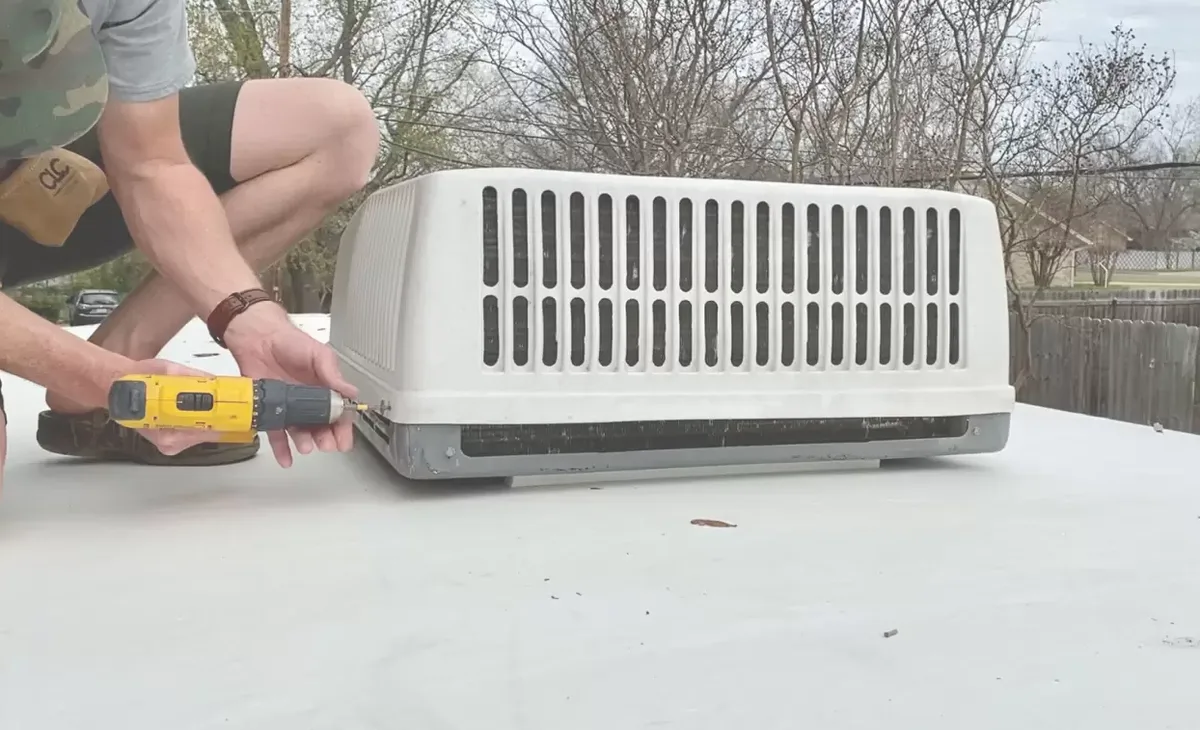 A rooftop air conditioner unit being opened for service in Micco, Florida