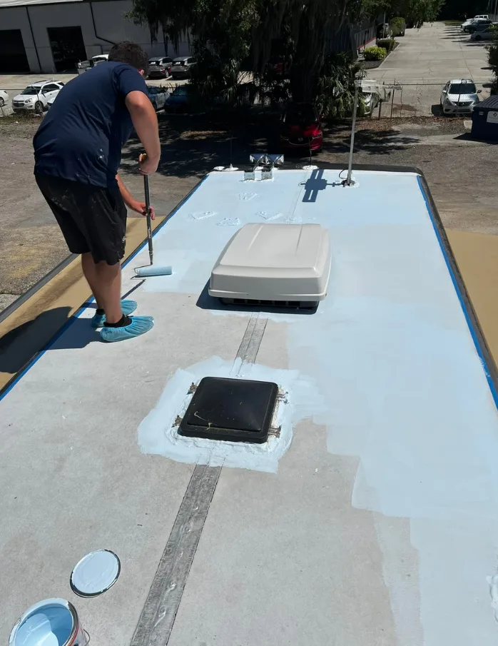 Fresh sealant coating applied across an RV roof in Winter Beach, Florida